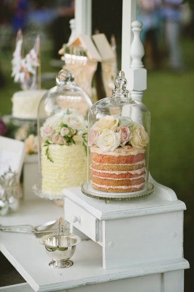 Delicous! Gorgeous cake table for your wedding reception cakes under domes: