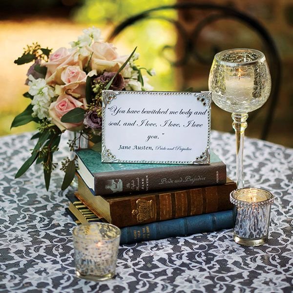 "Love story" using old books centerpiece for a wedding. Use quotes or include how the couple met, when, where. Great conversation starter.: 