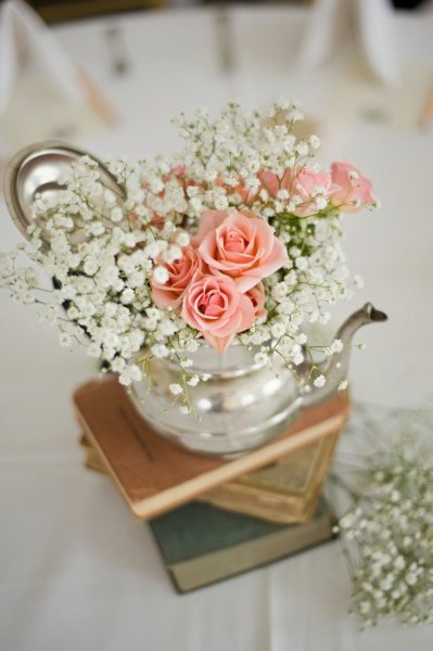 Super sweet wedding floral arrangement...the teapot and vintage books are gorgeous ideas!: 