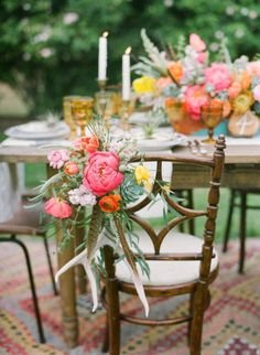 peonies, ranunculus and feathers decorating the seats | Photography by brycecoveyphotography.com |  Coordination, Design + Paper Design by bashplease.com | Floral Design by primarypetals.squarespace.com |   Read more - http://www.stylemepretty.com/2013/07/30/ojai-wedding-inspiration-from-bash-please-primary-petals-bryce-covey-photography/