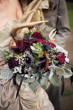 Antler dramatic bouquet with dusty miller, black calla lillies, red roses, succulents