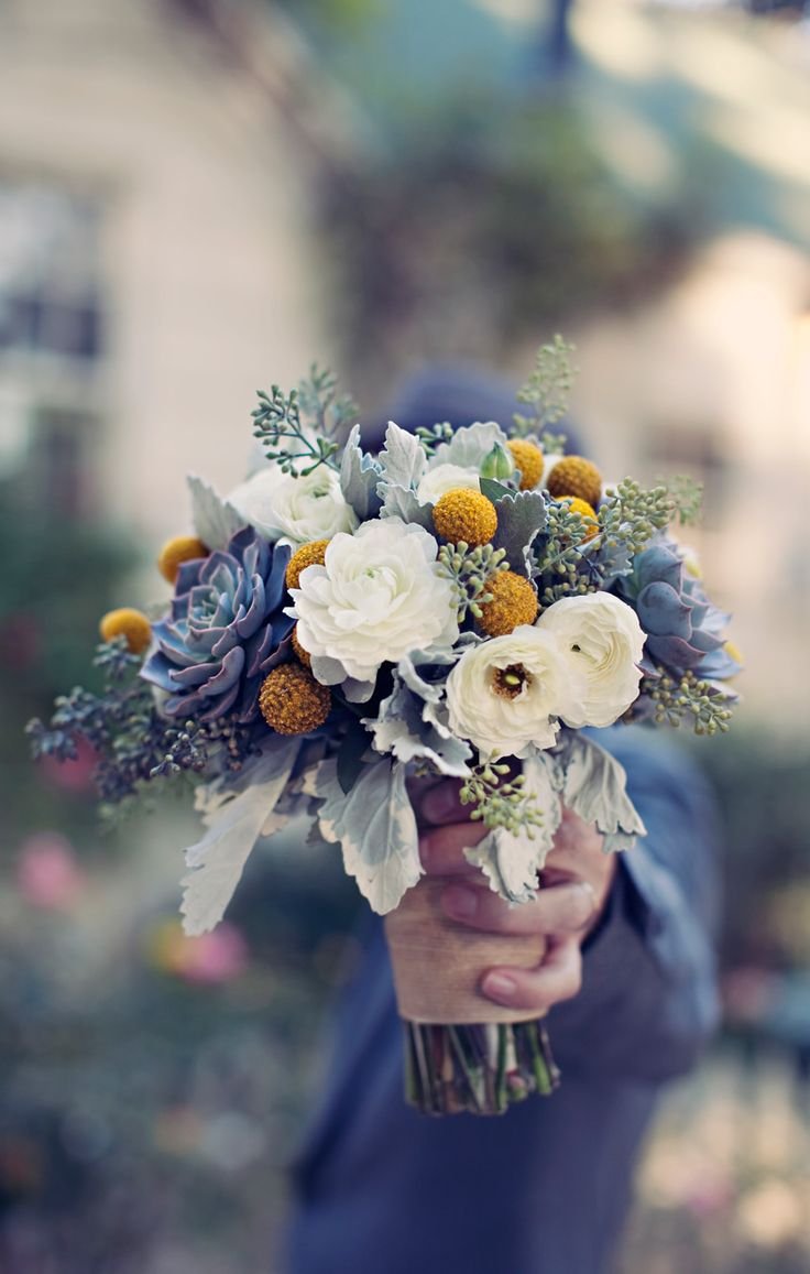 Unusual choice of flowers clustered together, but it works if the bride really, really loves blue!!: 