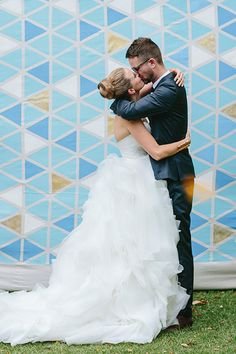 Kate and Anthony’s Quirky Garden Wedding. Colorful metallic geometric painted backdrop.